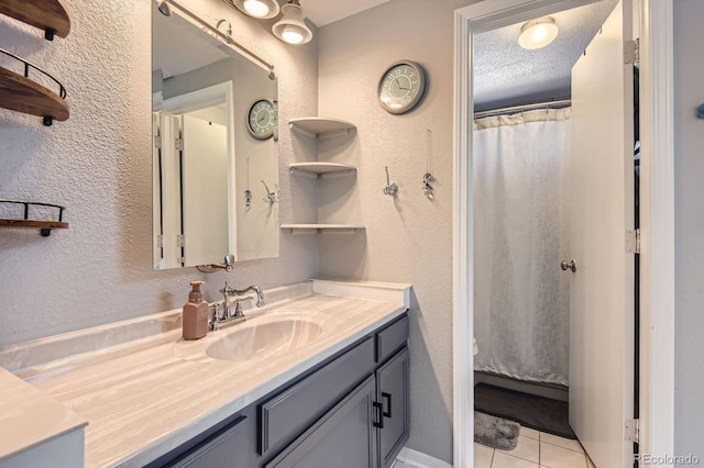2890 W Long Cir Unit A, Littleton, CO 80120 - full bath featuring vanity, tile patterned floors, and a textured wall