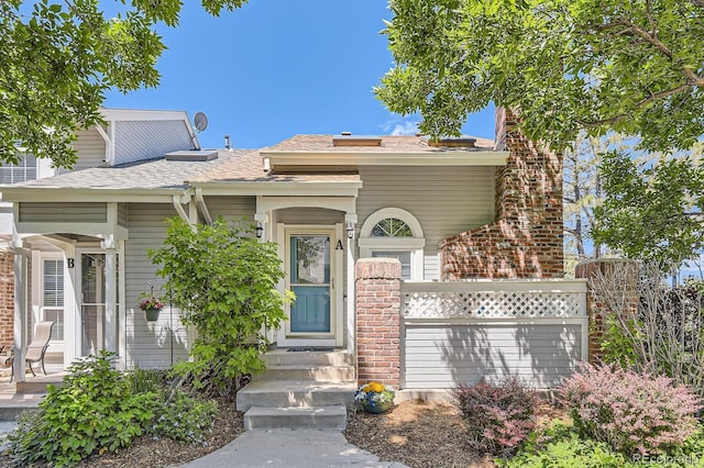 2890 W Long Cir Unit A, Littleton, CO 80120 - view of front facade with a shingled roof