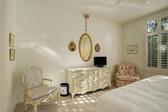 bedroom with light carpet and ceiling fan