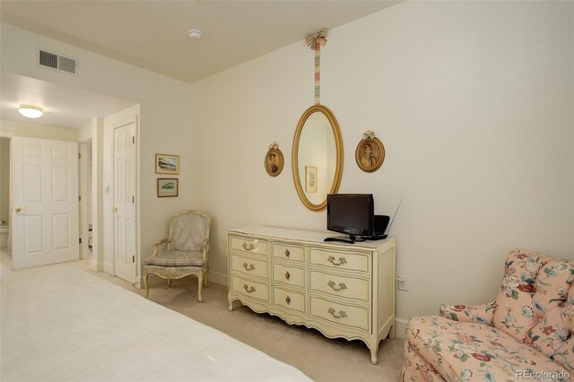 bedroom featuring light colored carpet