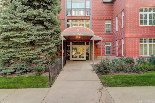 property entrance with french doors and a balcony