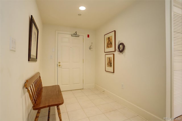 corridor featuring light tile patterned floors