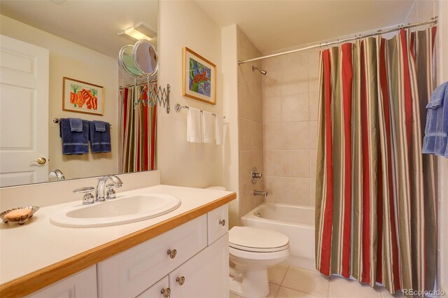 full bathroom with shower / tub combo with curtain, tile patterned flooring, vanity, and toilet