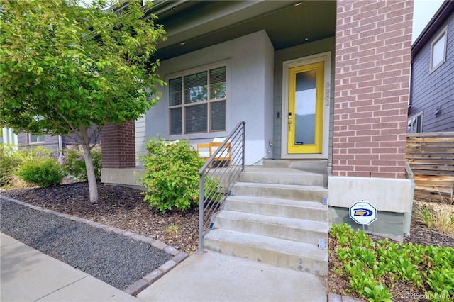 6682 Osage St, Denver, CO 80221 - doorway to property with stucco siding and brick siding