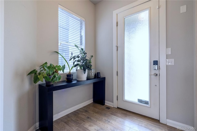 6682 Osage St, Denver, CO 80221 - entryway with light wood-style flooring and baseboards