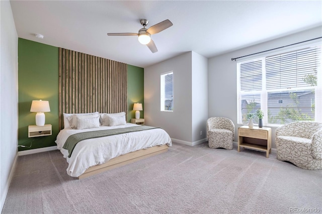 6682 Osage St, Denver, CO 80221 - carpeted bedroom with multiple windows, baseboards, and a ceiling fan