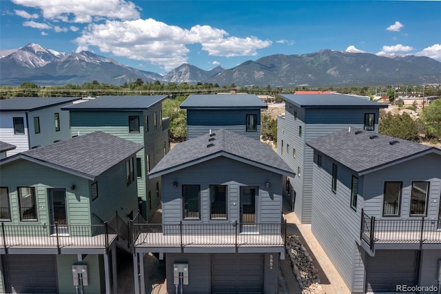 585 N Railroad St, Buena Vista, CO 81211 - view of front of house featuring a mountain view, an attached garage, and a residential view