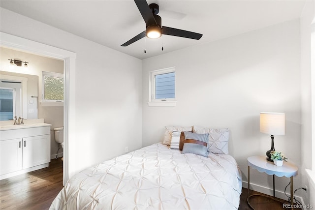 585 N Railroad St, Buena Vista, CO 81211 - bedroom with wood finished floors, connected bathroom, and ceiling fan