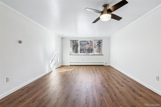 unfurnished living room with a baseboard heating unit, a wealth of natural light, hardwood / wood-style floors, and ornamental molding