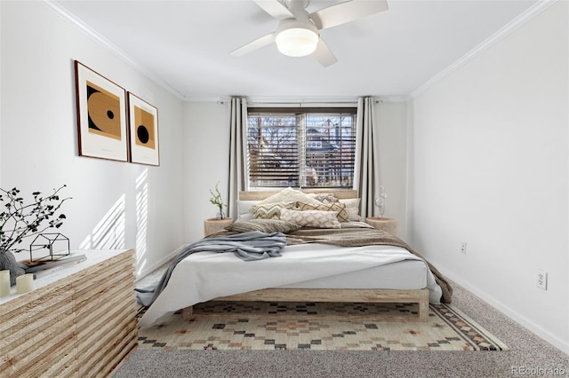 carpeted bedroom featuring crown molding and ceiling fan