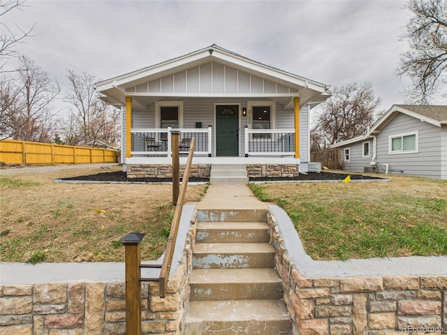 3150 S Pennsylvania St, Englewood, CO 80113 - view of front facade with a porch and board and batten siding