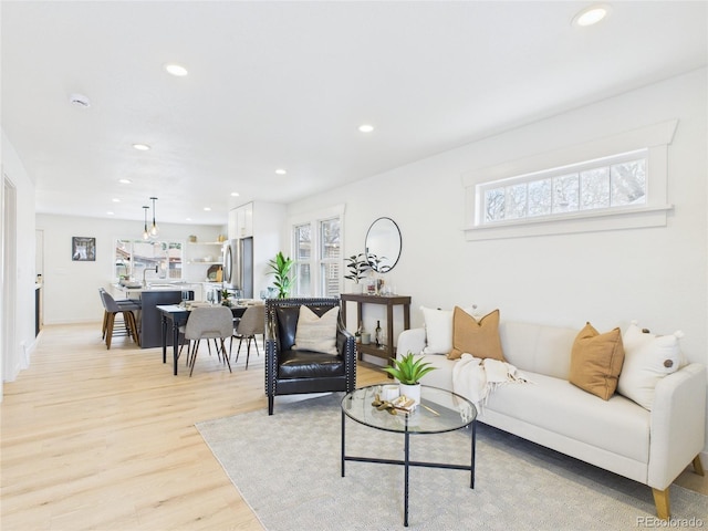 3150 S Pennsylvania St, Englewood, CO 80113 - living area with light wood finished floors and recessed lighting