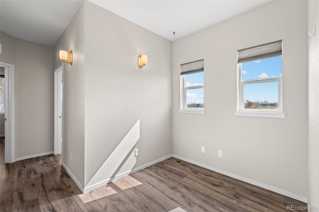 empty room with wood-type flooring