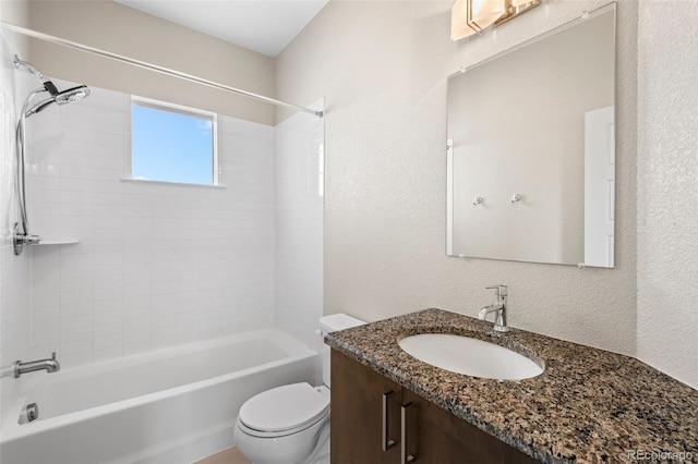 full bathroom featuring vanity, toilet, and tiled shower / bath combo