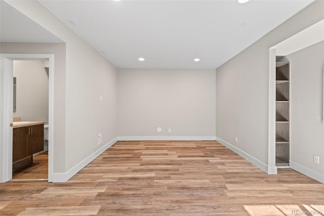 unfurnished room with light wood-type flooring