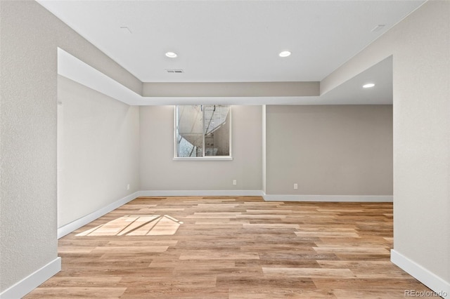 spare room featuring light hardwood / wood-style flooring