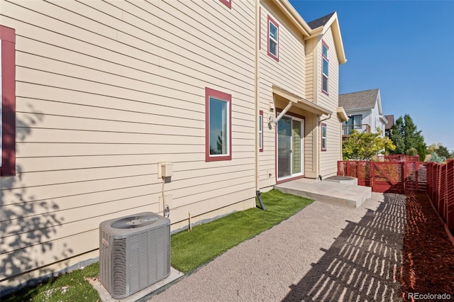 back of house with a patio and central AC