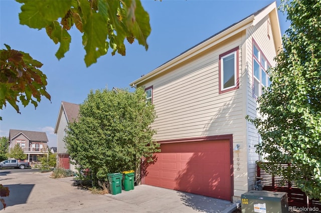 view of side of home with a garage