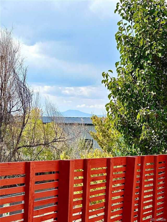 view of gate with a mountain view