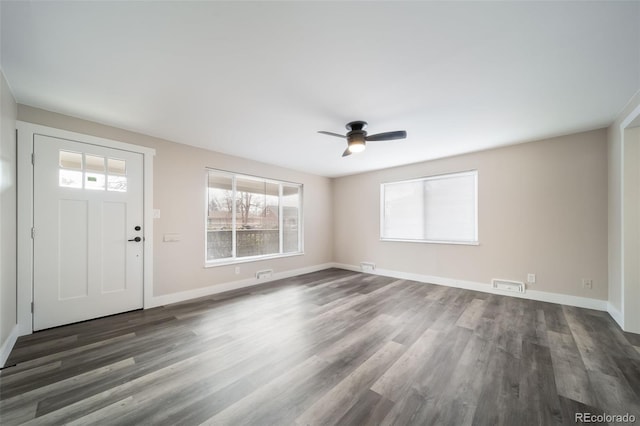 foyer with dark hardwood / wood-style floors and ceiling fan