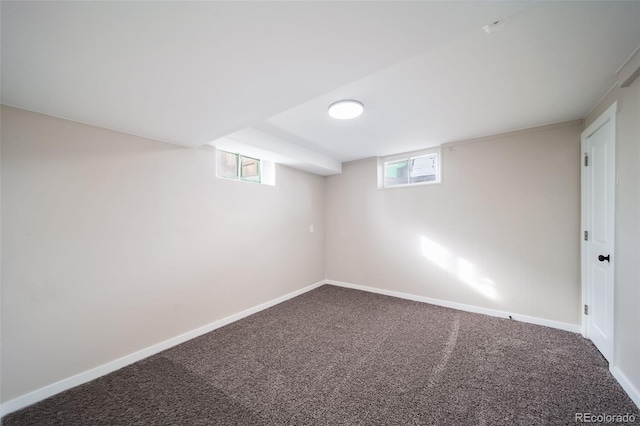 basement featuring plenty of natural light and carpet flooring