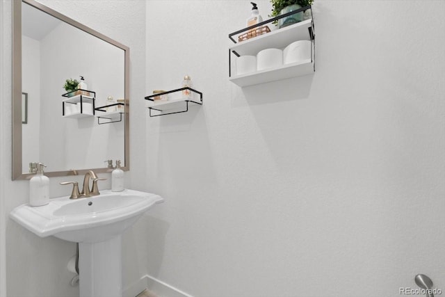 14601 Hudson St, Thornton, CO 80602 - bathroom featuring baseboards