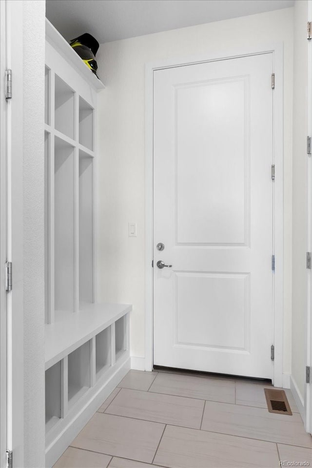 14601 Hudson St, Thornton, CO 80602 - mudroom with baseboards and tile patterned floors