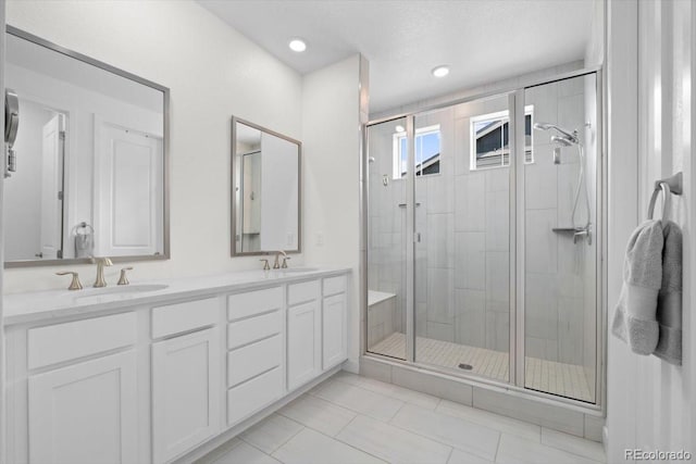 14601 Hudson St, Thornton, CO 80602 - bathroom featuring a stall shower, double vanity, and tile patterned floors