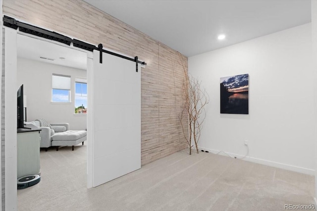14601 Hudson St, Thornton, CO 80602 - empty room with a barn door and carpet floors