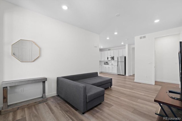 14601 Hudson St, Thornton, CO 80602 - living area with recessed lighting and light wood-style flooring