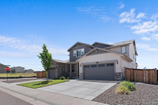 14601 Hudson St, Thornton, CO 80602 - craftsman-style house featuring stone siding, driveway, and an attached garage