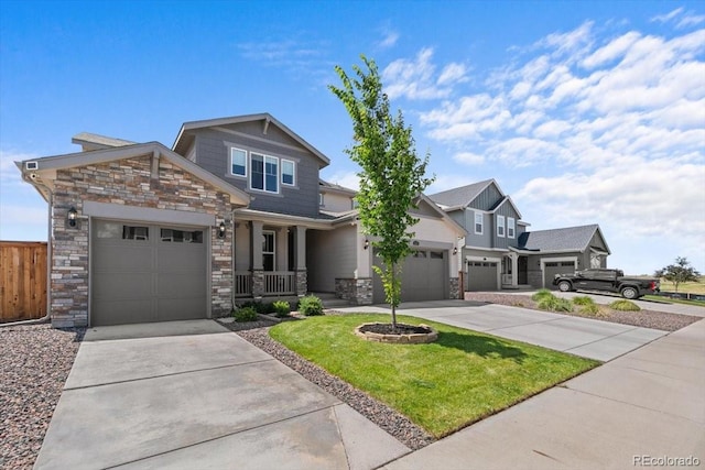 14601 Hudson St, Thornton, CO 80602 - craftsman-style house with stone siding, driveway, an attached garage, and covered porch