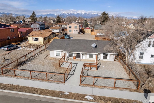 birds eye view of property featuring a mountain view