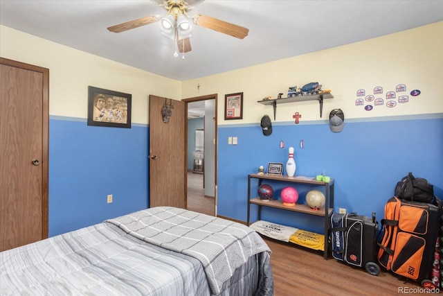 bedroom with wood-type flooring and ceiling fan