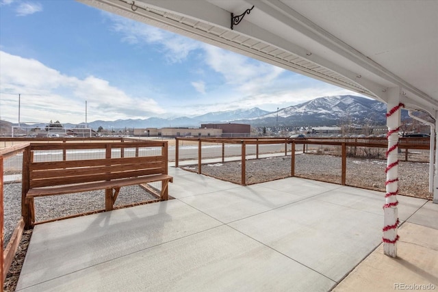 view of patio / terrace featuring a mountain view