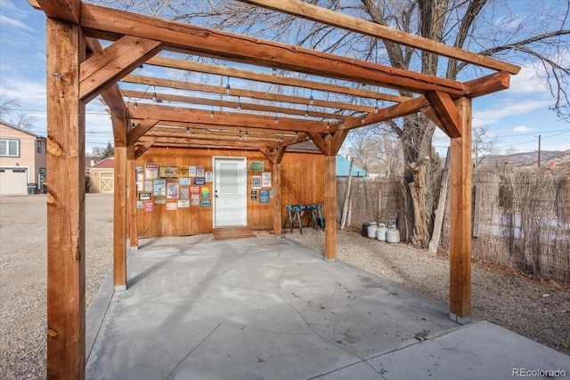 view of patio / terrace with an outbuilding