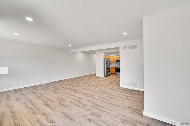 6485 S Havana St Unit A, Englewood, CO 80111 - empty room with recessed lighting, baseboards, visible vents, and light wood-style flooring