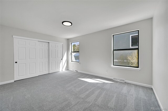 6485 S Havana St Unit A, Englewood, CO 80111 - unfurnished bedroom with visible vents, baseboards, and carpet floors