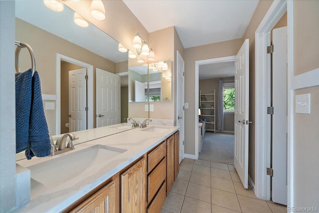 10610 Winterflower Way, Parker, CO 80134 - bathroom with double vanity, tile patterned floors, toilet, and baseboards