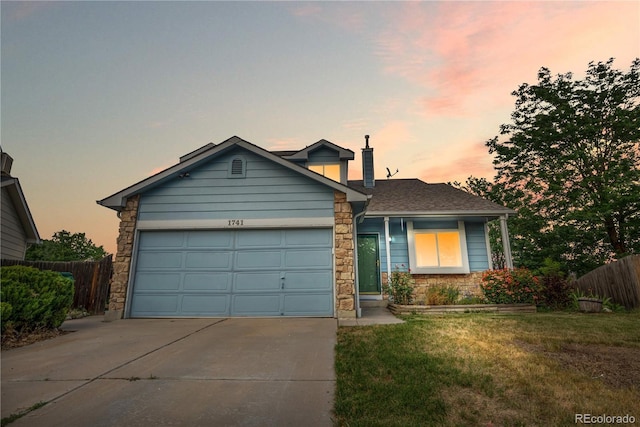 1741 W 131st Ct, Denver, CO 80234 - view of front facade featuring stone siding, driveway, an attached garage, roof with shingles, and a chimney