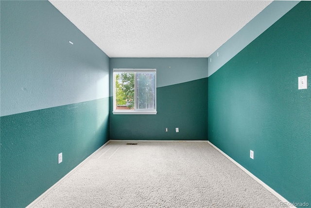 1741 W 131st Ct, Denver, CO 80234 - carpeted spare room with a textured ceiling and a textured wall