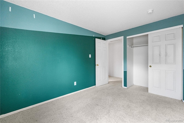 1741 W 131st Ct, Denver, CO 80234 - unfurnished bedroom with carpet, lofted ceiling, a textured ceiling, and a closet