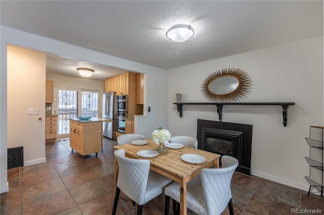 dining room with a textured ceiling