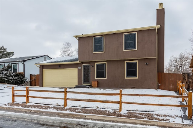 view of front of property with a garage