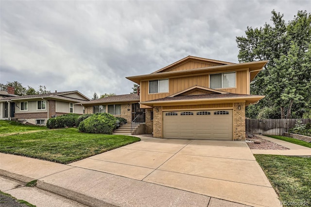 view of front of home featuring a front lawn and a garage