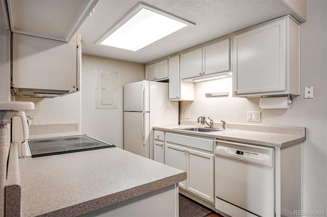 8335 Fairmount Dr Unit 9-206, Denver, CO 80247 - kitchen with a sink, white appliances, white cabinetry, light countertops, and a textured wall