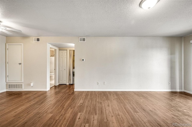 8335 Fairmount Dr Unit 9-206, Denver, CO 80247 - spare room with ceiling fan, visible vents, a textured ceiling, and wood finished floors