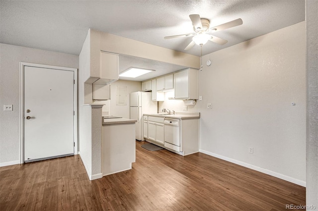 8335 Fairmount Dr Unit 9-206, Denver, CO 80247 - kitchen featuring white cabinetry, dark wood-style floors, ceiling fan, and white appliances