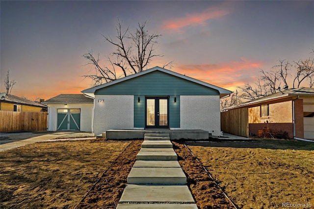 view of front of house featuring french doors and a garage