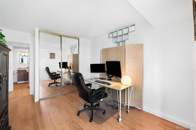 office space featuring light wood-style flooring